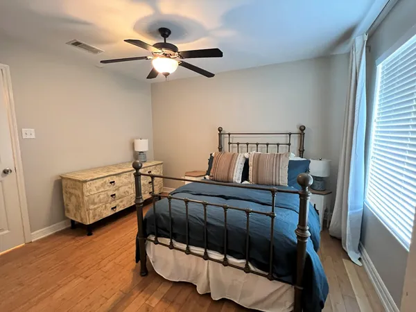 a bedroom with furniture and a window