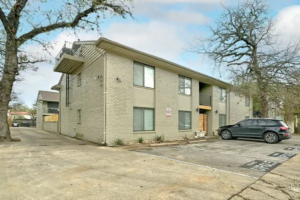 a front view of a house with parking space