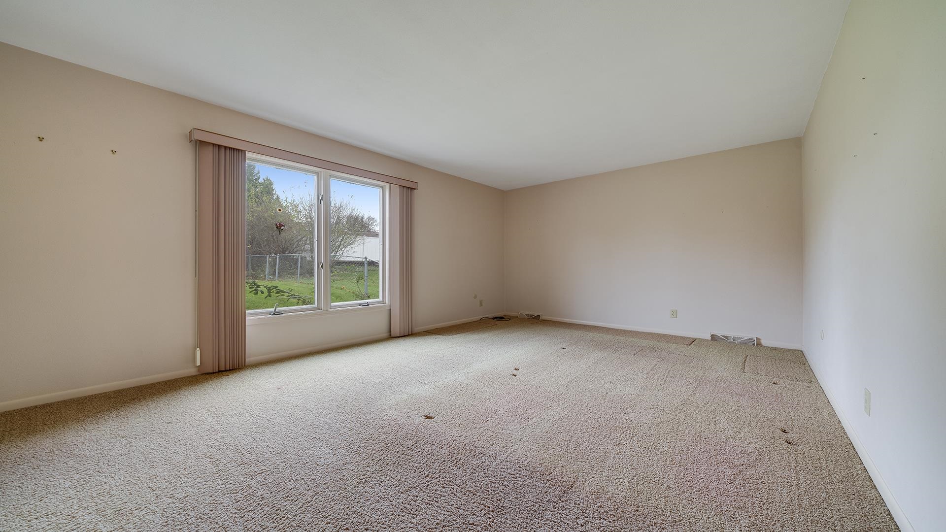 1247 Roxbury Road Rockford, IL 61107 - Photo 18 of 37 a view of an empty room with windows