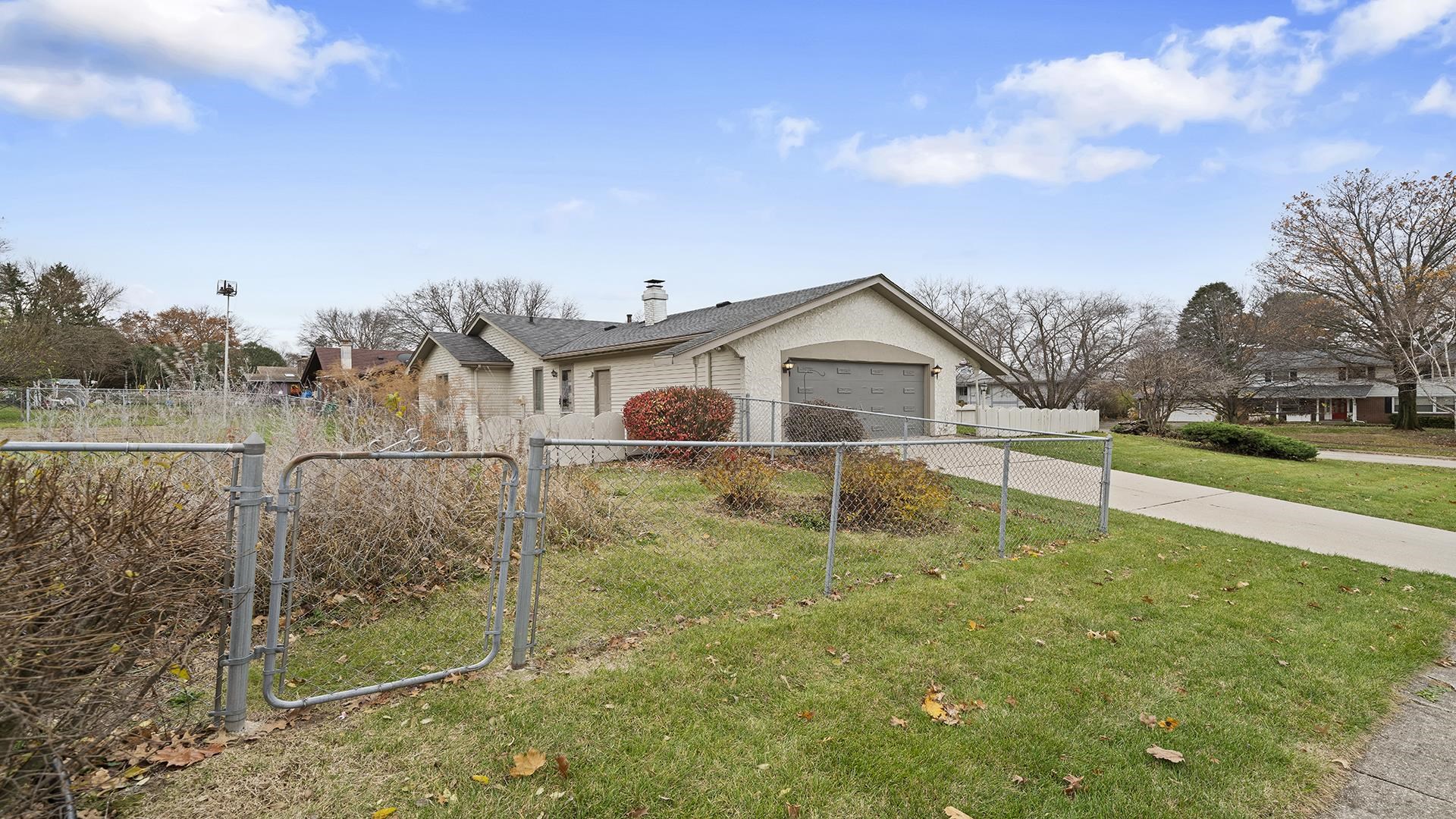 1247 Roxbury Road Rockford, IL 61107 - Photo 3 of 37 a house view with swimming pool in front of it