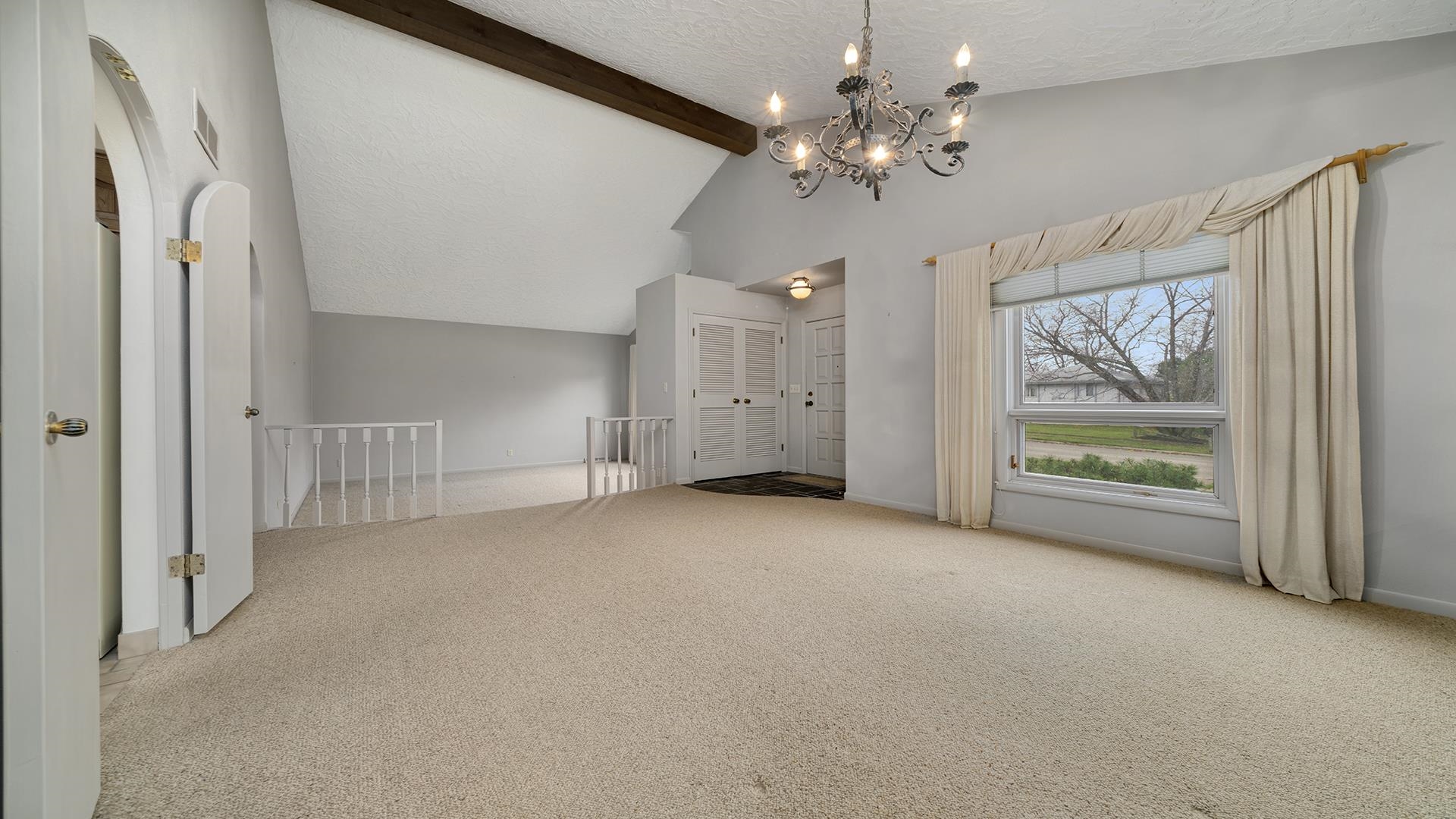 1247 Roxbury Road Rockford, IL 61107 - Photo 7 of 37 en empty room with windows and ceiling fan