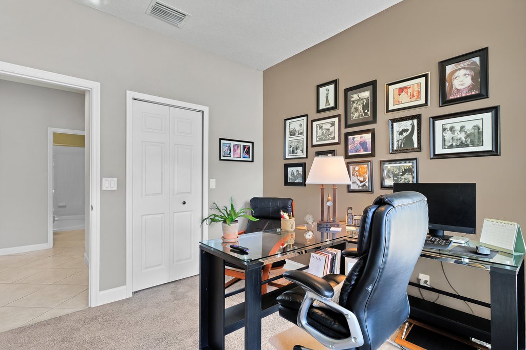 3812 Kitty Hawk Lane Southwest Vero Beach, FL 32968 - Photo 18 of 36 a view of a workspace with furniture and a workspace