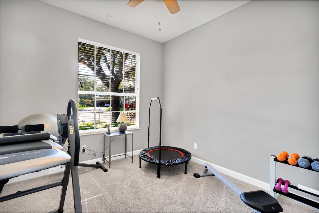 3812 Kitty Hawk Lane Southwest Vero Beach, FL 32968 - Photo 19 of 36 a room with furniture and gym equipment