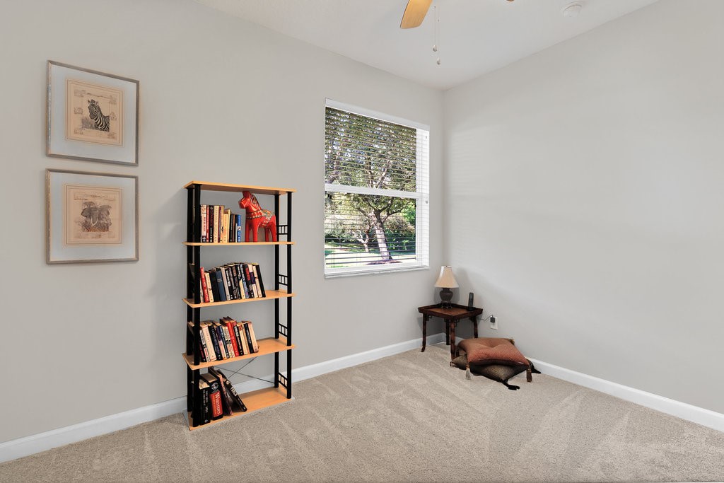 3812 Kitty Hawk Lane Southwest Vero Beach, FL 32968 - Photo 20 of 36 a room with furniture and a book shelf