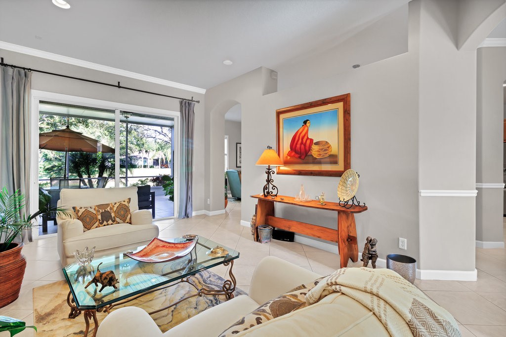 3812 Kitty Hawk Lane Southwest Vero Beach, FL 32968 - Photo 2 of 36 a bedroom with furniture and a painting on the wall