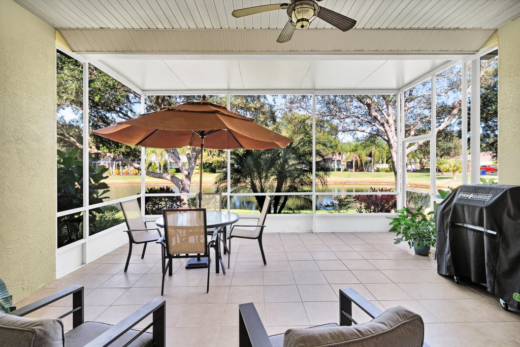 3812 Kitty Hawk Lane Southwest Vero Beach, FL 32968 - Photo 22 of 36 a patio with a patio table and chairs