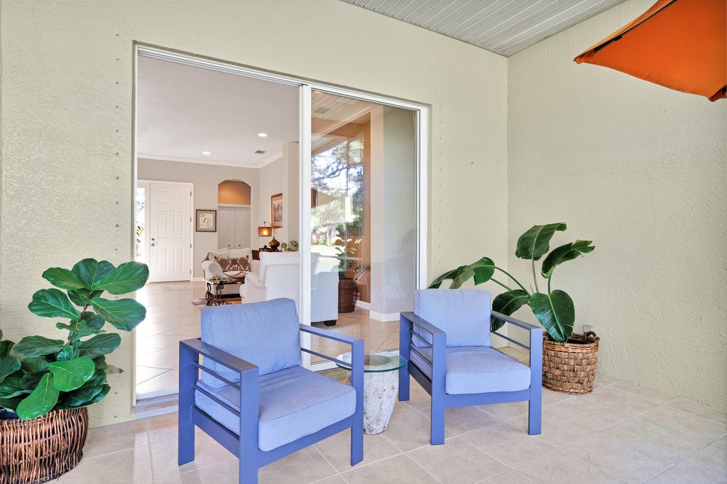 3812 Kitty Hawk Lane Southwest Vero Beach, FL 32968 - Photo 24 of 36 a living room with furniture potted plant and a window