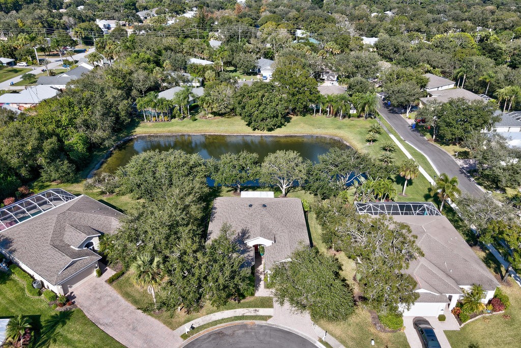 3812 Kitty Hawk Lane Southwest Vero Beach, FL 32968 - Photo 27 of 36 an aerial view of a house with a yard