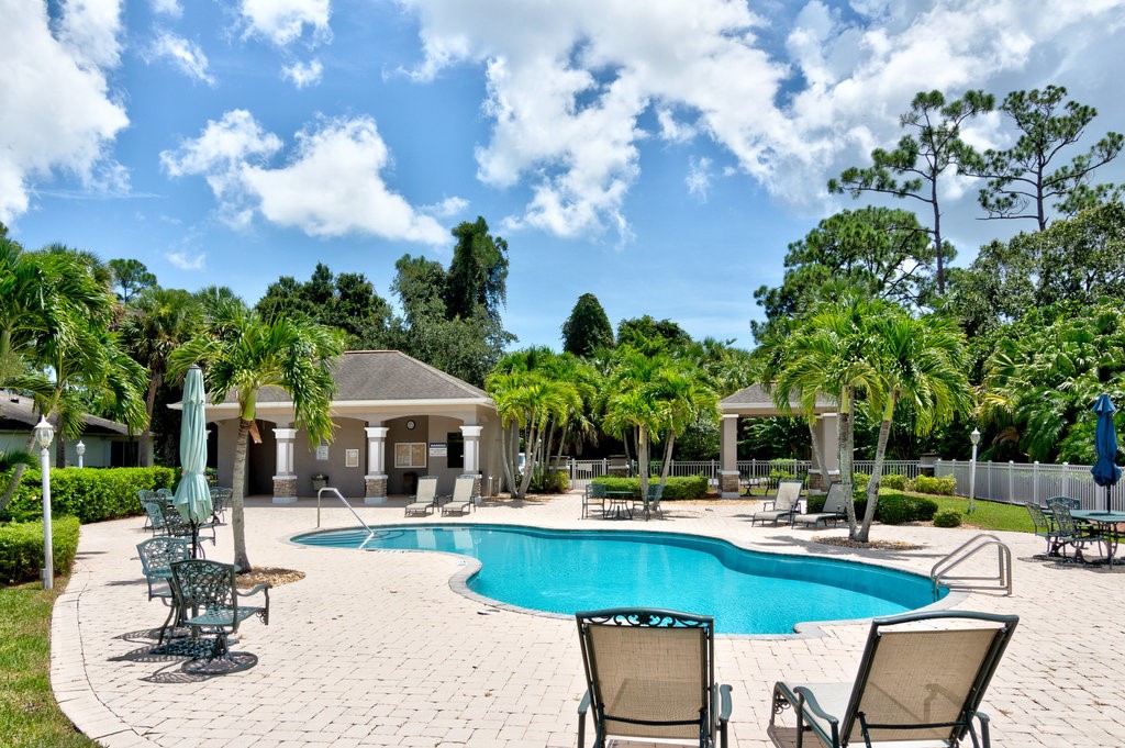 3812 Kitty Hawk Lane Southwest Vero Beach, FL 32968 - Photo 29 of 36 a swimming pool with outdoor seating and yard