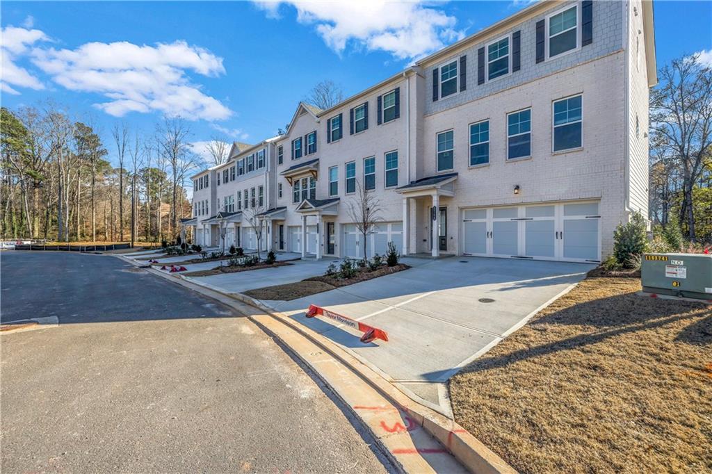 5772 Schelton Place Mableton, GA 30126 - Photo 2 of 24 a view of a building with many windows