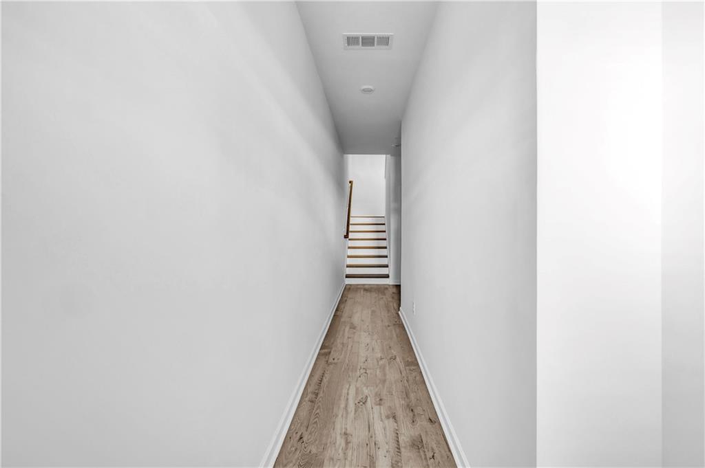 5772 Schelton Place Mableton, GA 30126 - Photo 3 of 24 a view of a hallway with stairs