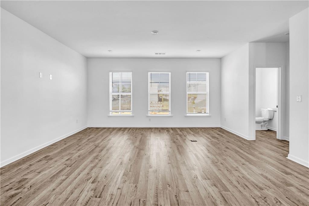 5772 Schelton Place Mableton, GA 30126 - Photo 8 of 24 wooden floor in an empty room with a window