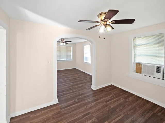 a view of an entryway with wooden floor