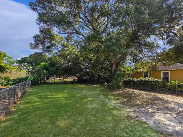 a backyard of a house with lots of green space