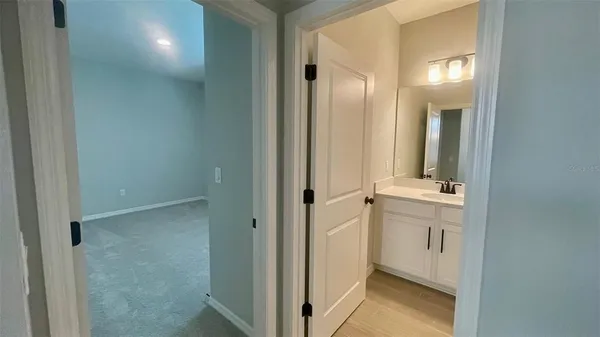 a bathroom with a sink and mirror