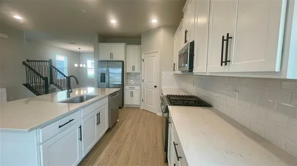 view of a kitchen with a sink and cabinets