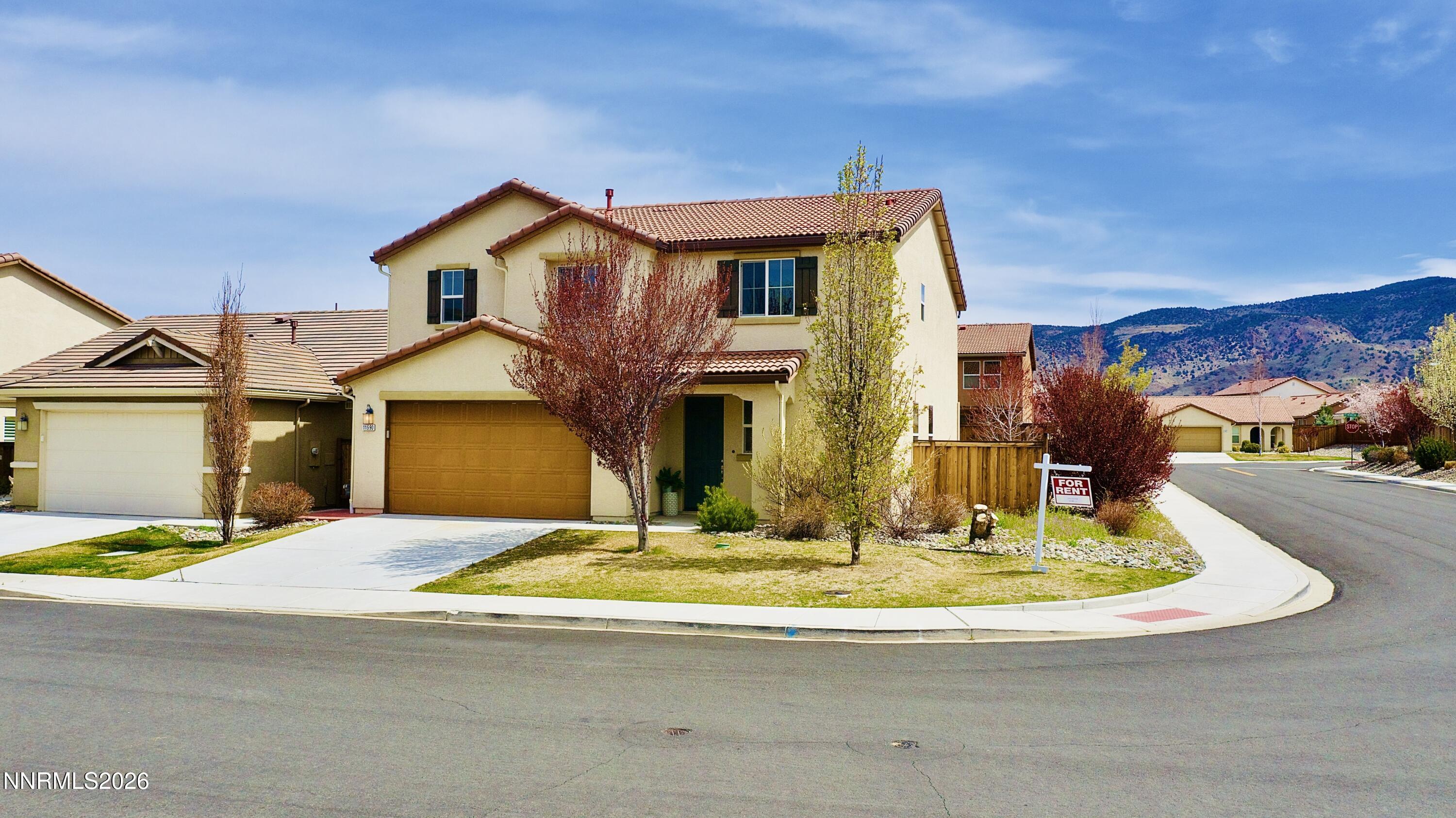 11590 Rivolli Court Reno, NV 89521 - Photo 1 of 22 a view of a house with a swimming pool