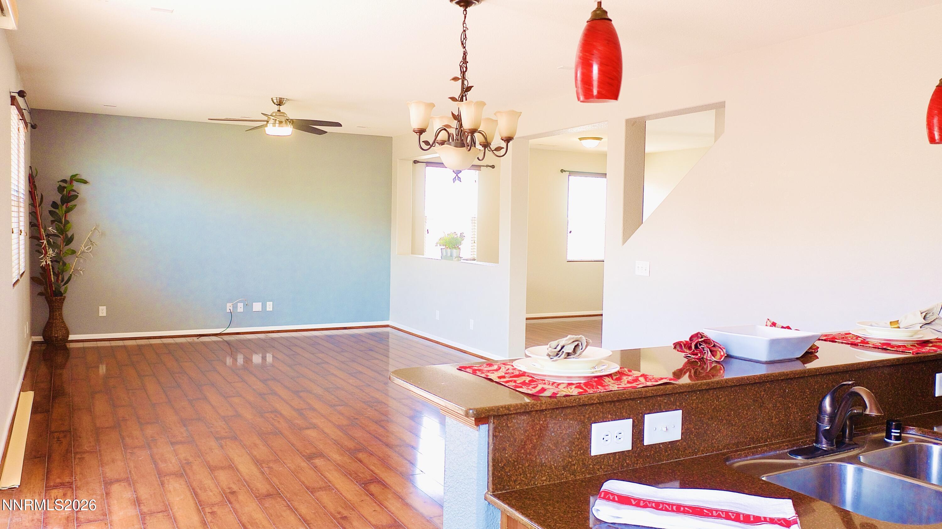 11590 Rivolli Court Reno, NV 89521 - Photo 11 of 22 a workspace with a chandelier