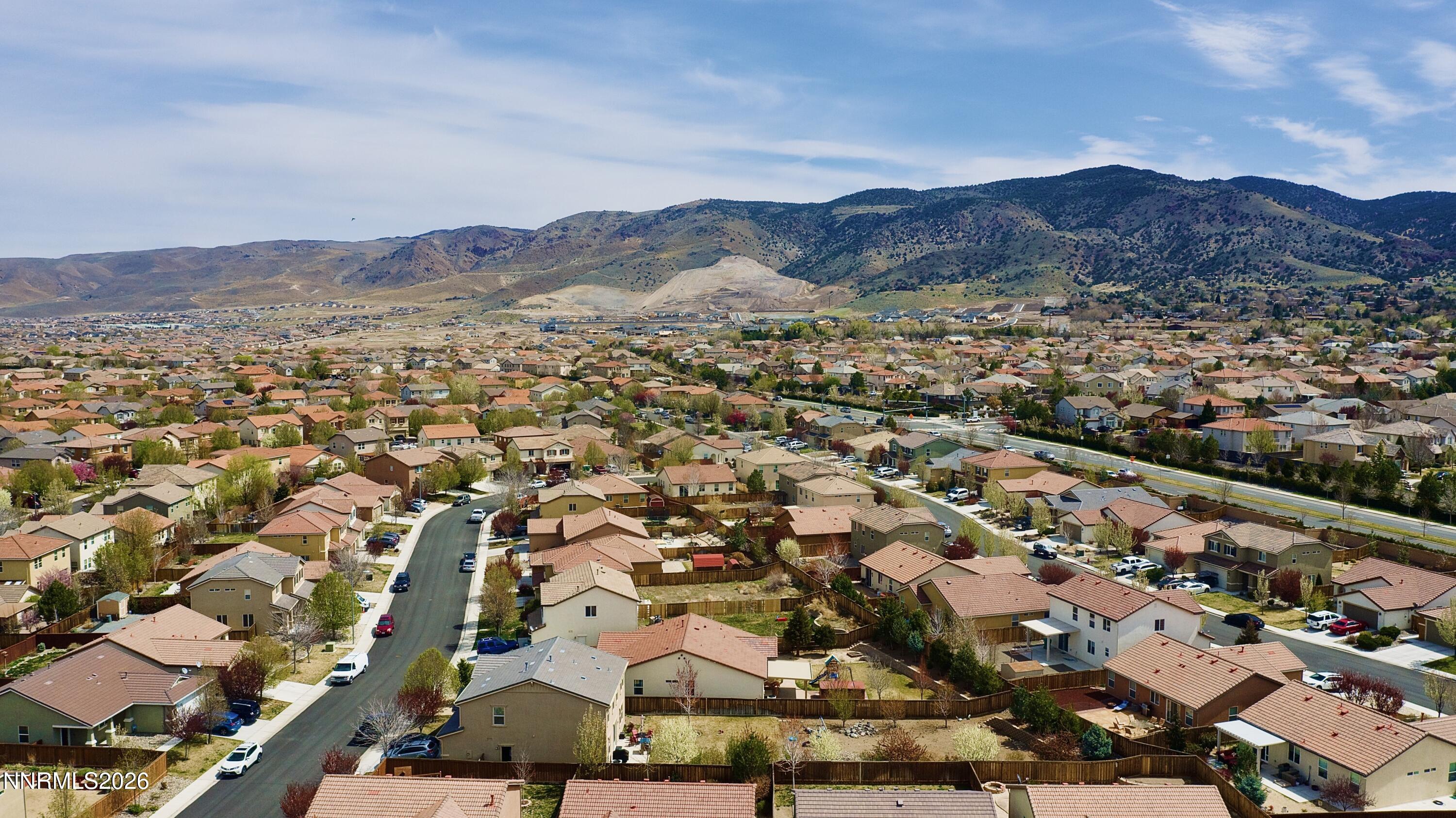 11590 Rivolli Court Reno, NV 89521 - Photo 22 of 22 an aerial view of residential houses with outdoor space and trees