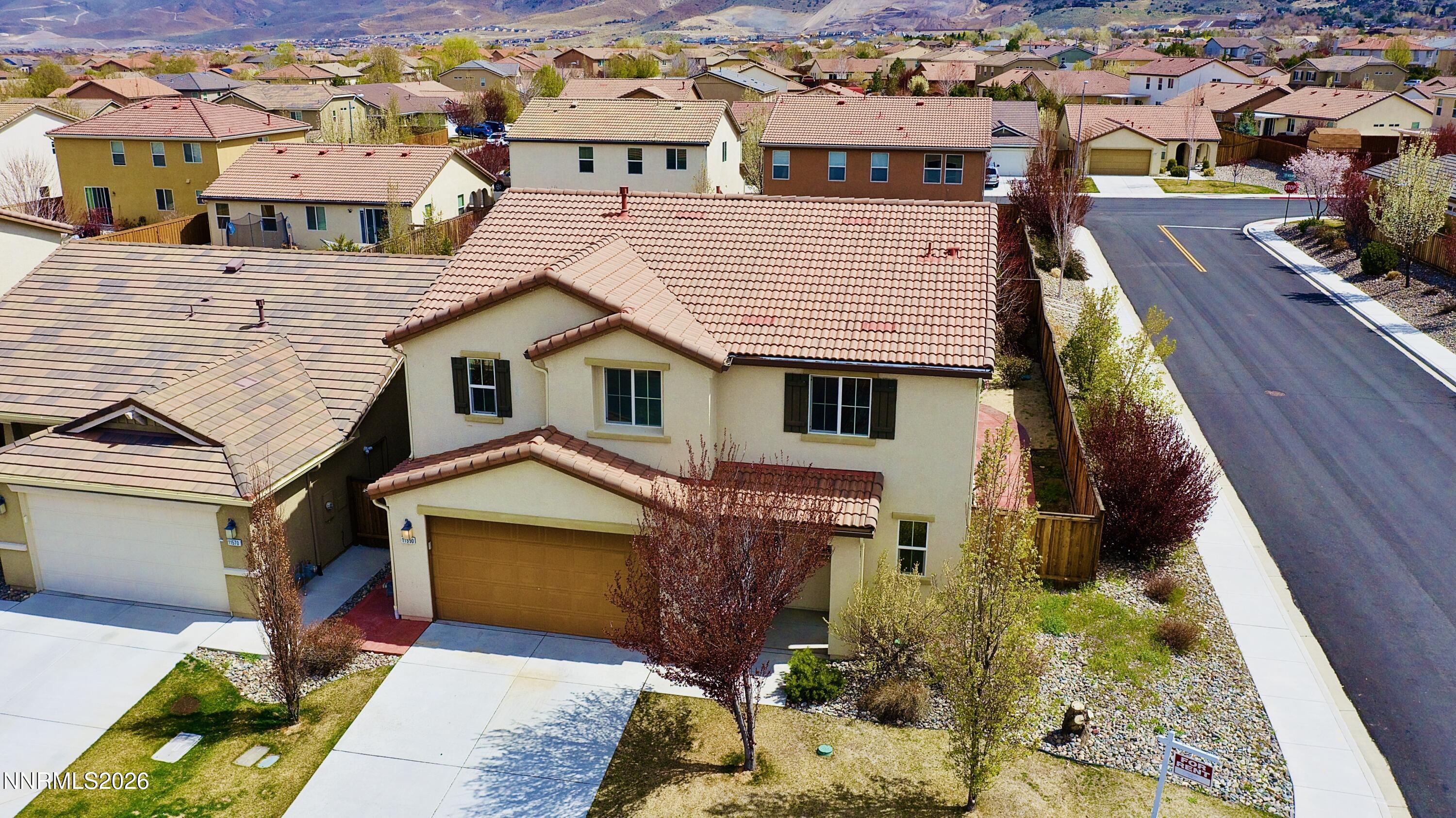 11590 Rivolli Court Reno, NV 89521 - Photo 3 of 22 an aerial view of a house with a yard