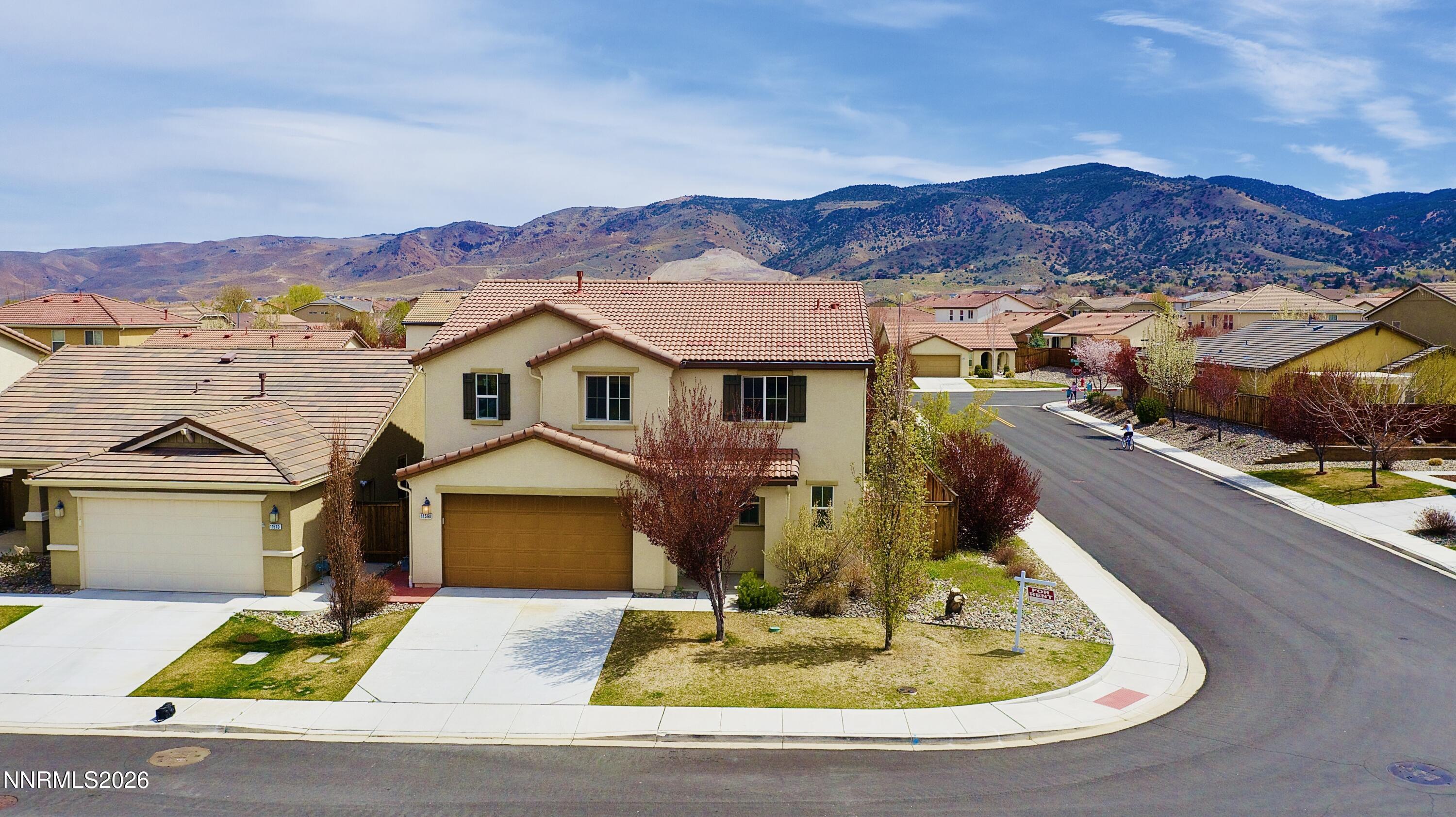 11590 Rivolli Court Reno, NV 89521 - Photo 4 of 22 a view of houses with a street