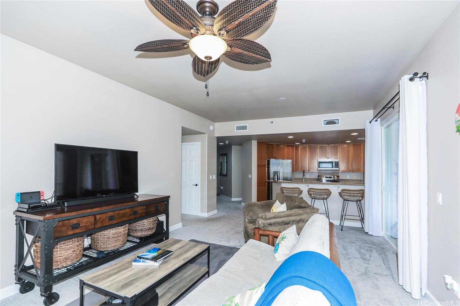 520 Lunalilo Home Road, Unit 6214 Honolulu, HI 96825 - Photo 9 of 25 a living room with furniture and a flat screen tv