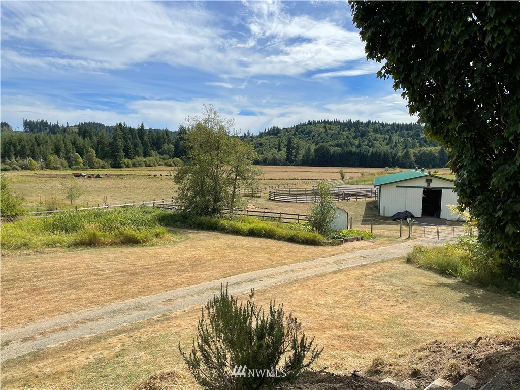 404 Independence Road Rochester, WA 98579 - Photo 11 of 40 a view of a lake with a house in the background