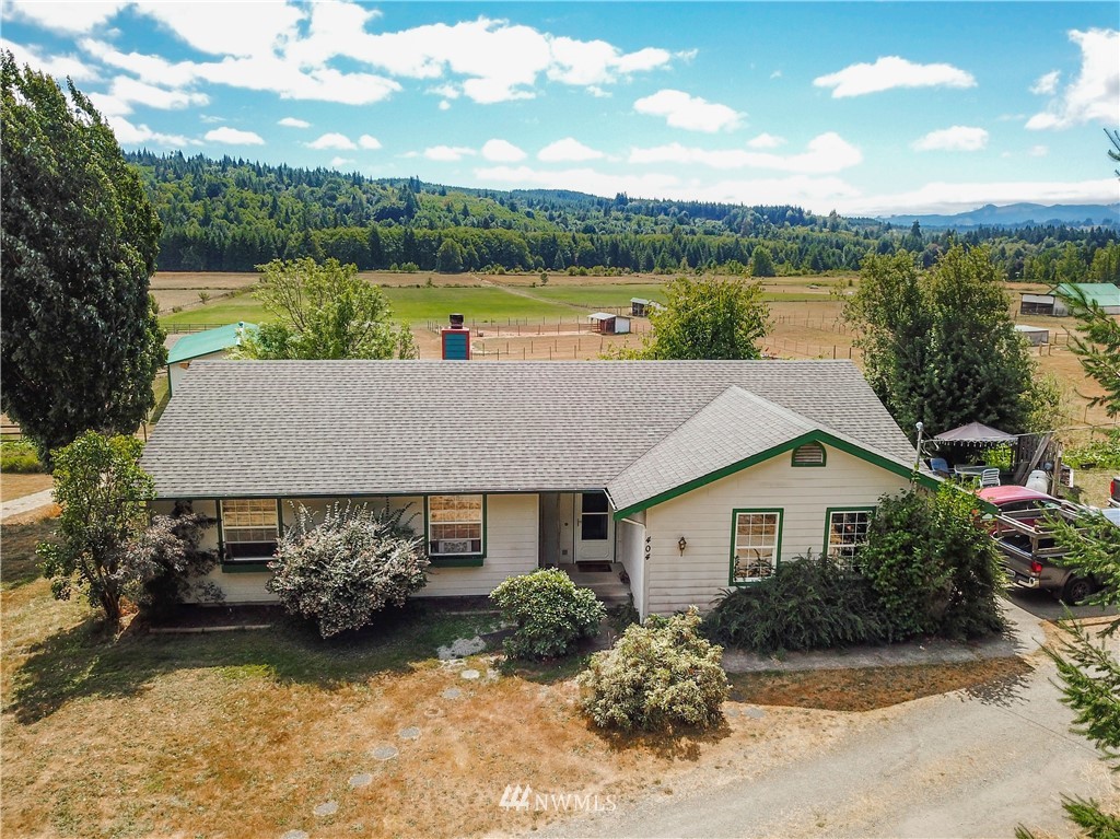 404 Independence Road Rochester, WA 98579 - Photo 21 of 40 a aerial view of a house with yard and lake view
