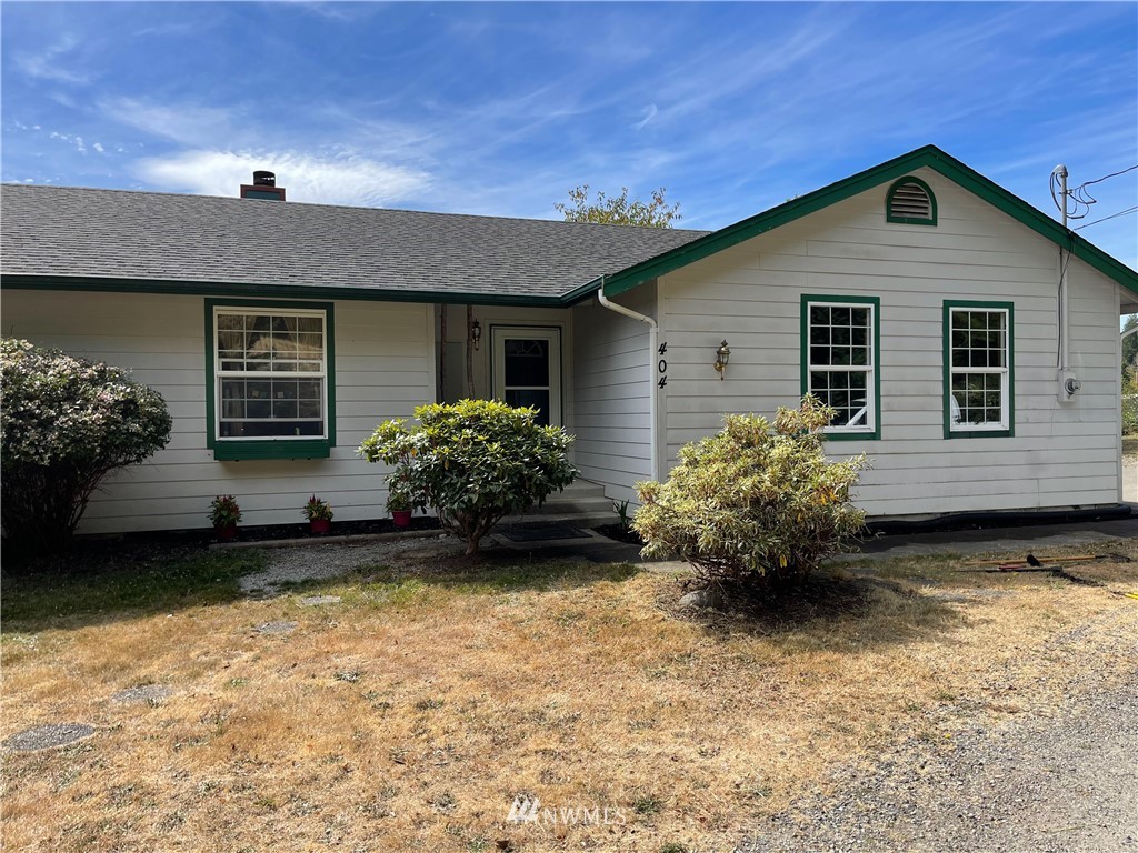 404 Independence Road Rochester, WA 98579 - Photo 22 of 40 a front view of a house with a yard