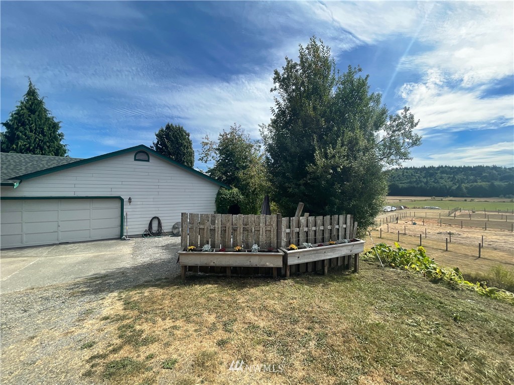 404 Independence Road Rochester, WA 98579 - Photo 23 of 40 a view of a deck with a chair