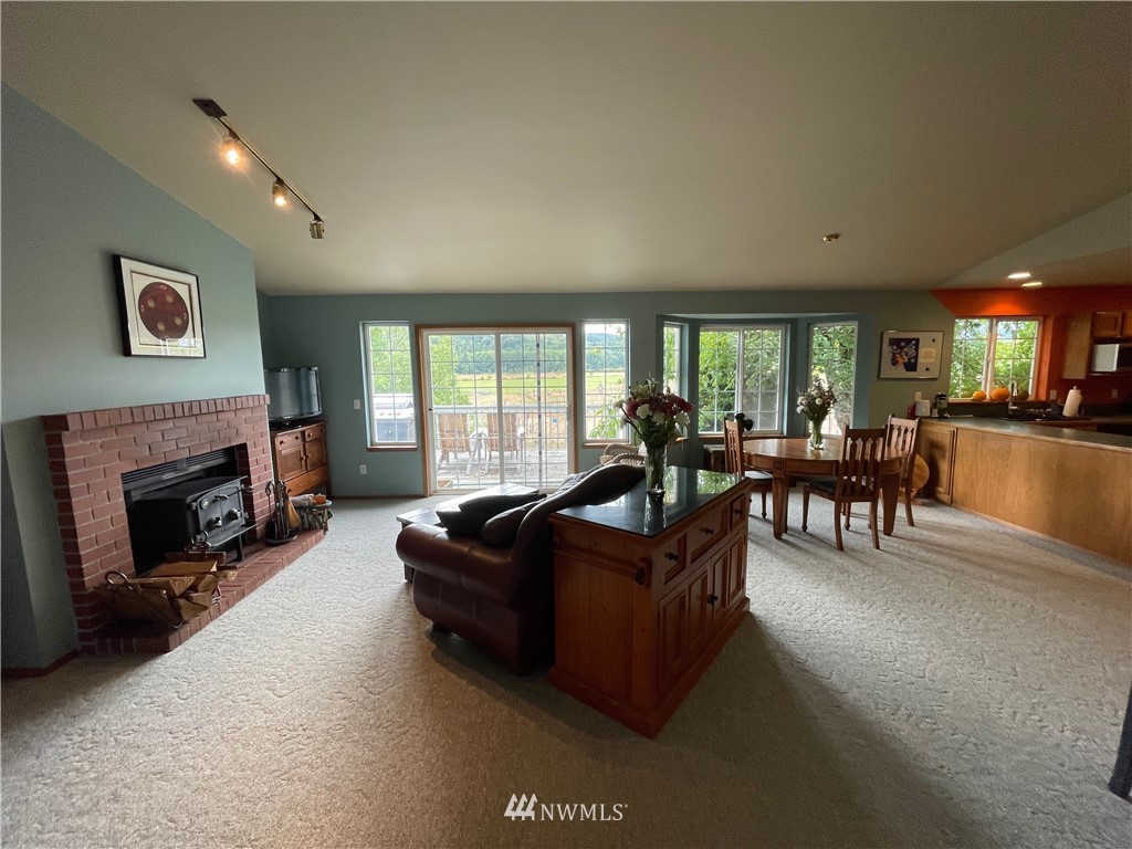 404 Independence Road Rochester, WA 98579 - Photo 25 of 40 a living room with furniture and a fireplace