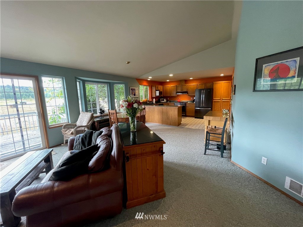 404 Independence Road Rochester, WA 98579 - Photo 26 of 40 a living room with furniture and a large window