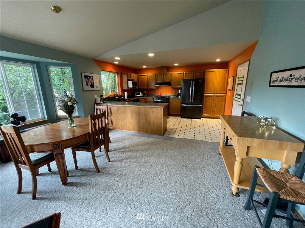404 Independence Road Rochester, WA 98579 - Photo 27 of 40 a view of a dining room with furniture and a livingroom