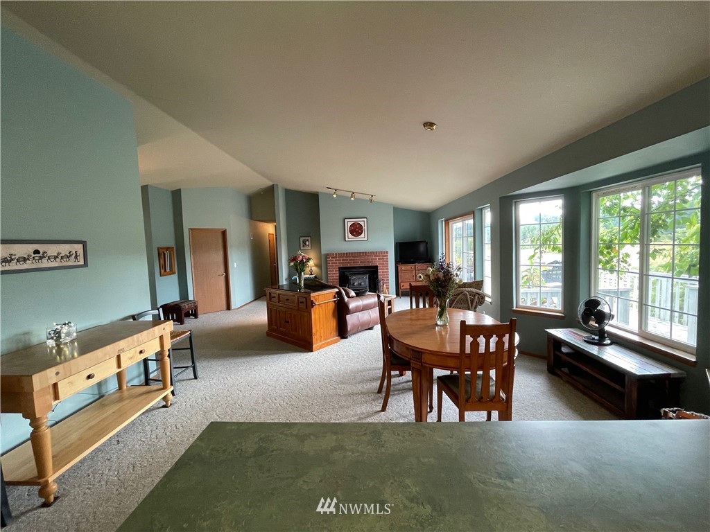 404 Independence Road Rochester, WA 98579 - Photo 29 of 40 a living room with furniture kitchen view and a large window