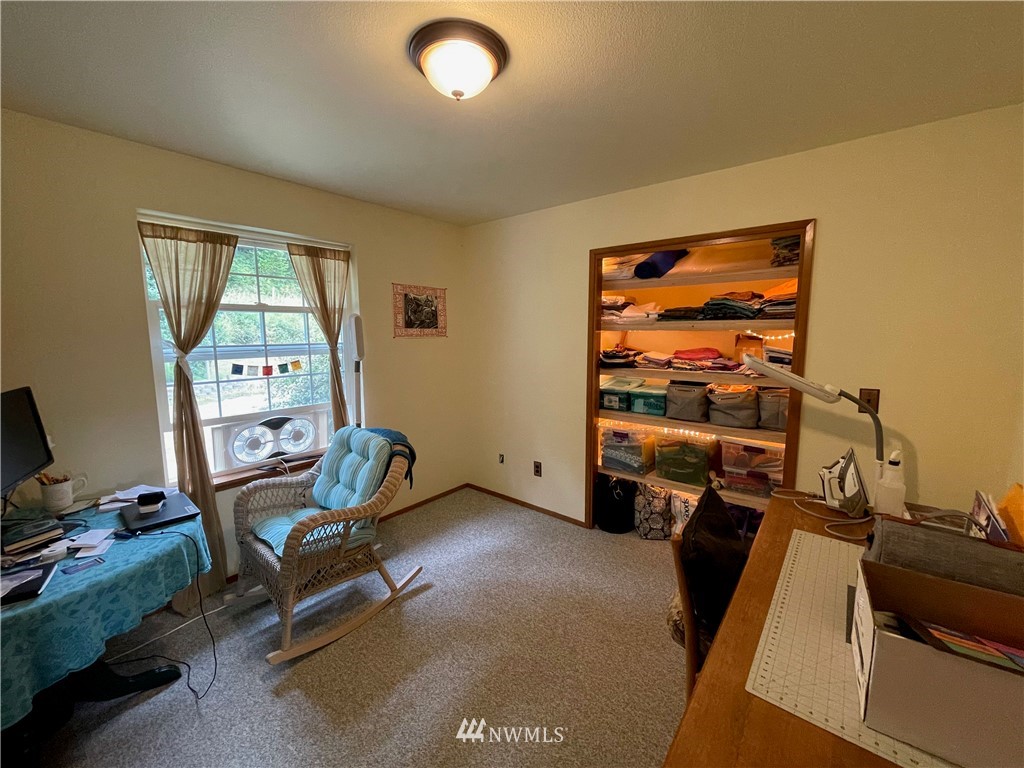404 Independence Road Rochester, WA 98579 - Photo 31 of 40 a view of a workspace with furniture and a window