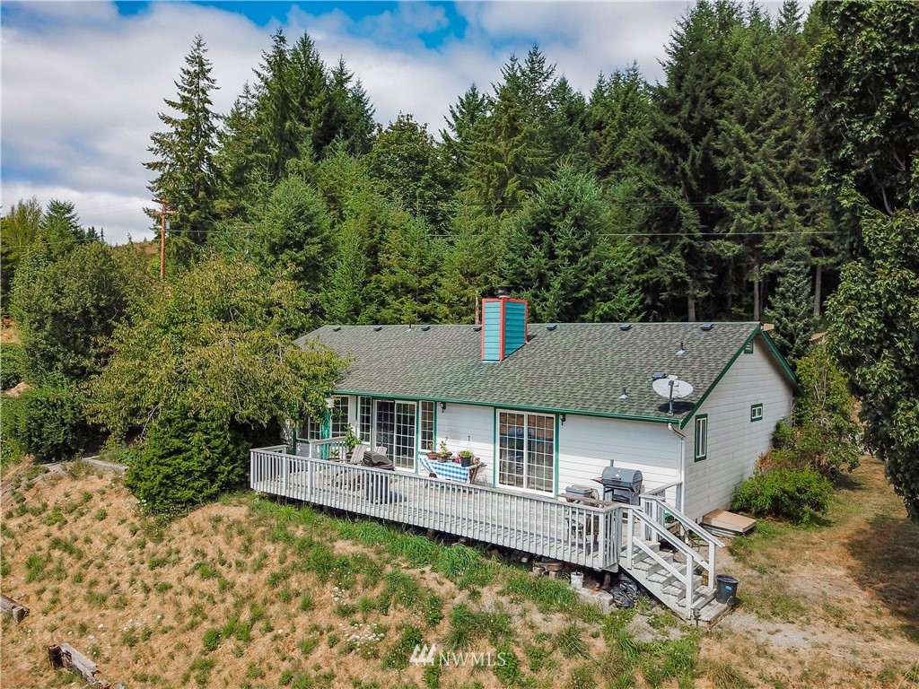 404 Independence Road Rochester, WA 98579 - Photo 39 of 40 an aerial view of a house with swimming pool and furniture