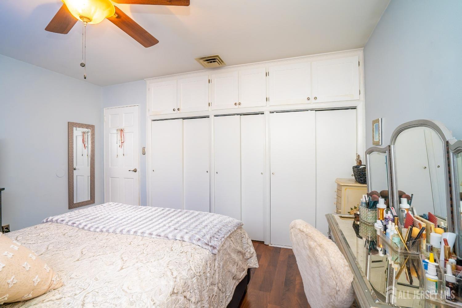 23 Winthrop Road Edison, NJ 08817 - Photo 24 of 29 a bedroom with a bed and a chandelier