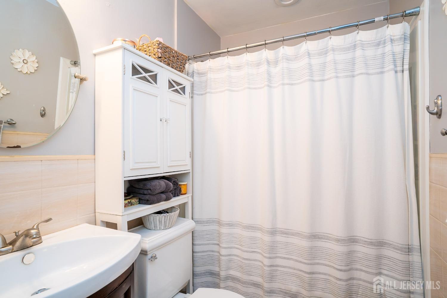 23 Winthrop Road Edison, NJ 08817 - Photo 7 of 29 a bathroom with a sink and a mirror