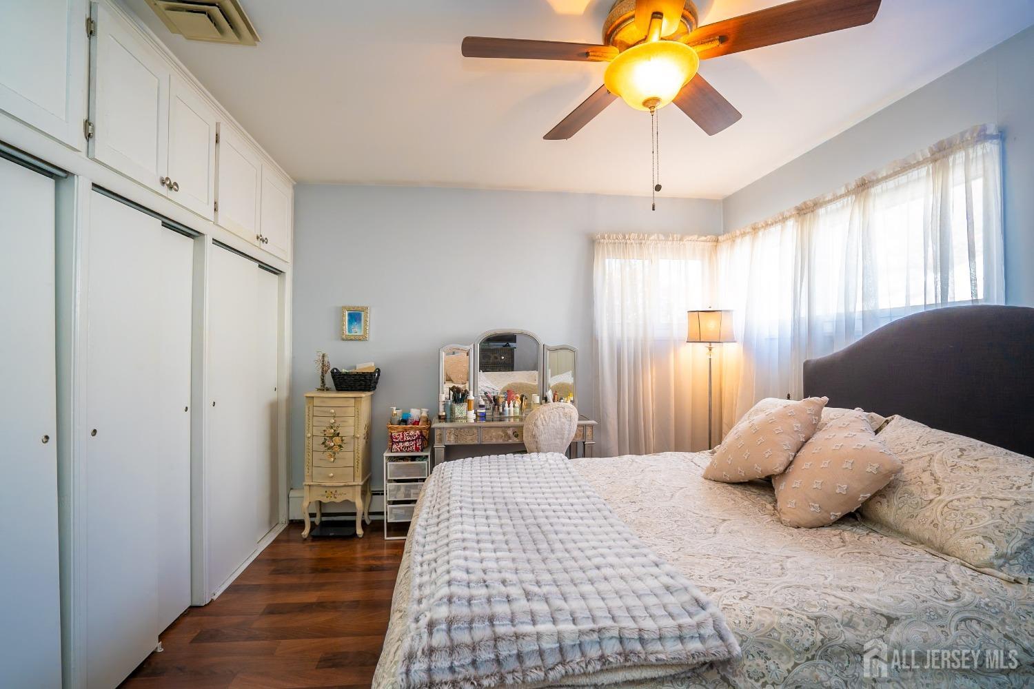 23 Winthrop Road Edison, NJ 08817 - Photo 9 of 29 a bedroom with a bed and a chandelier
