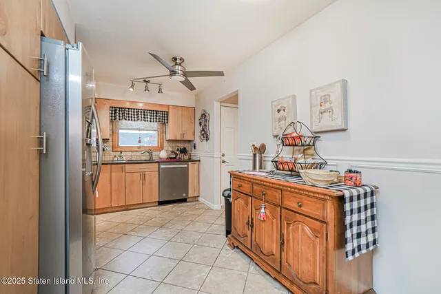 a bathroom with a sink vanity mirror and toilet