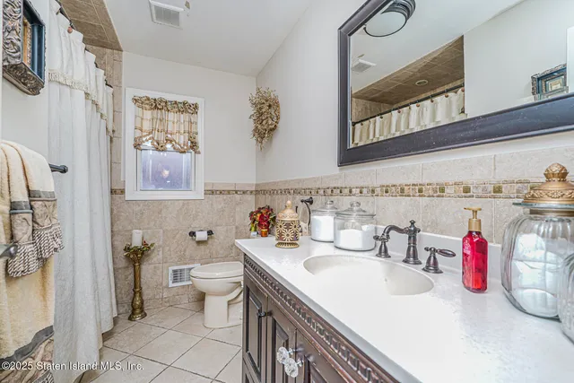 a bedroom with a bed and dresser