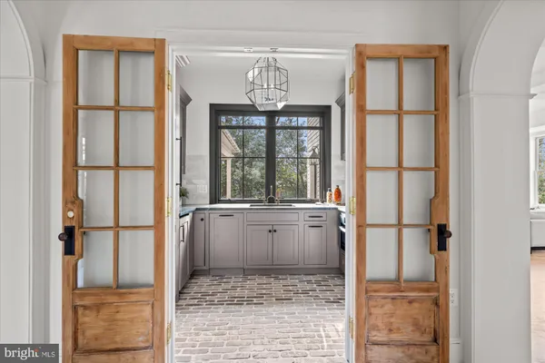 a bathroom with a granite countertop sink a toilet a mirror and shower