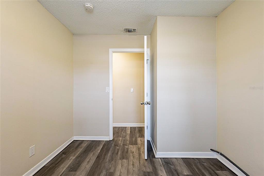 8528 Gold Ridge Circle Tampa, FL 33619 - Photo 11 of 31 a view of a room with wooden floor