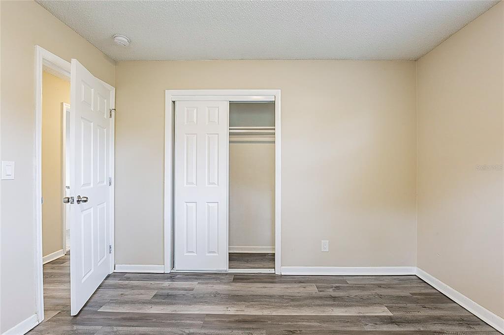 8528 Gold Ridge Circle Tampa, FL 33619 - Photo 14 of 31 a view of a livingroom with wooden floor