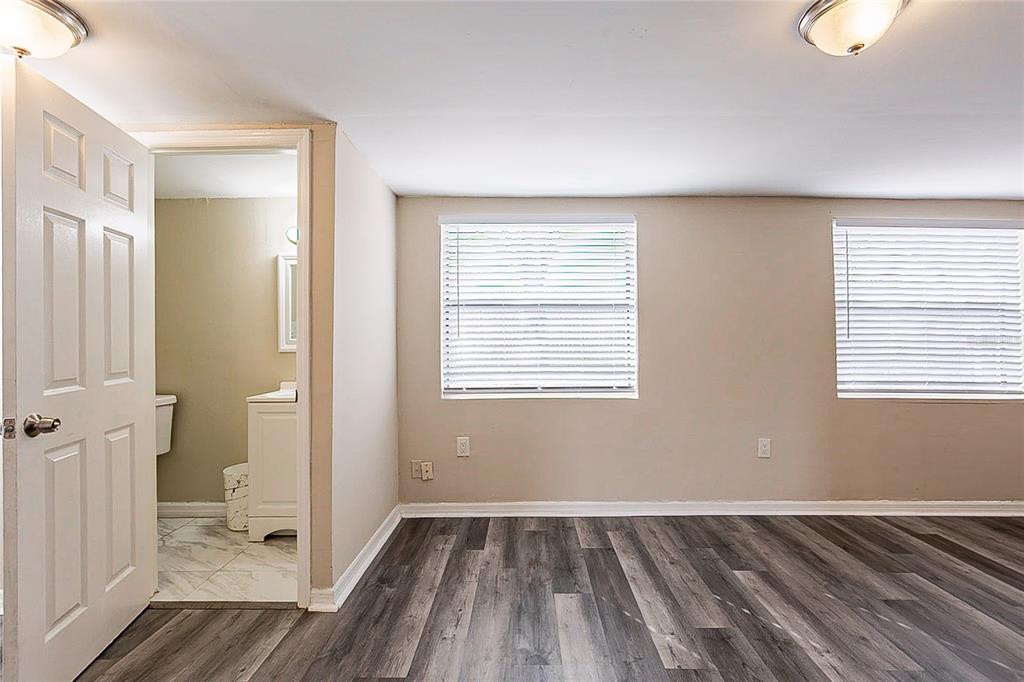 8528 Gold Ridge Circle Tampa, FL 33619 - Photo 20 of 31 a view of a room with wooden floor and a window