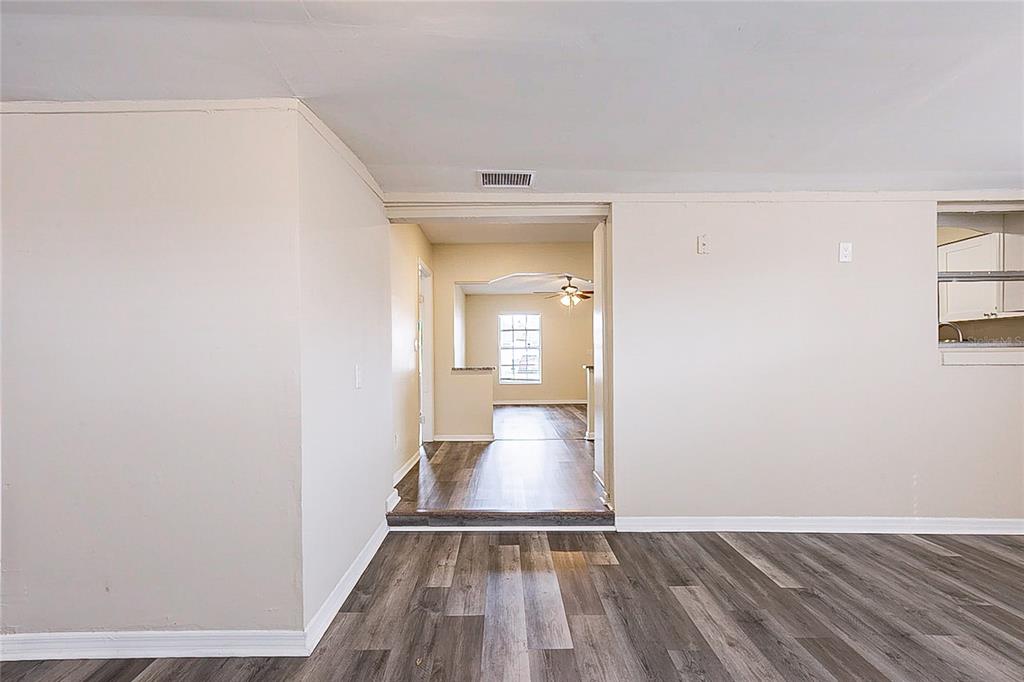 8528 Gold Ridge Circle Tampa, FL 33619 - Photo 22 of 31 a view of a room with wooden floor and a sink
