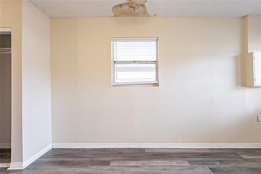 8528 Gold Ridge Circle Tampa, FL 33619 - Photo 26 of 31 a view of a small space with wooden floor and a window