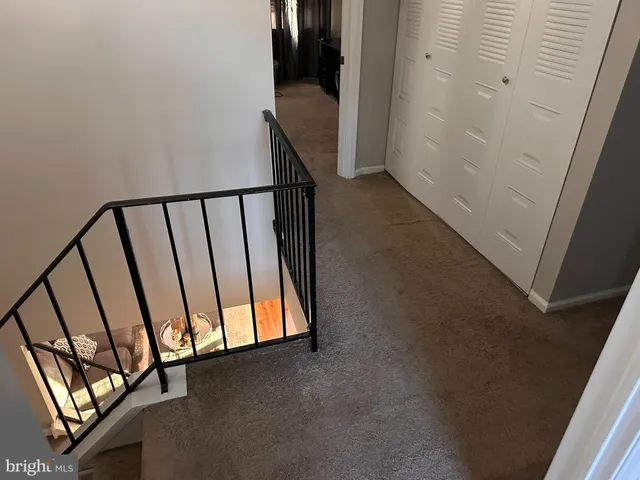 a bathroom with a sink and mirror with shower