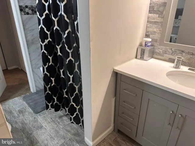 a view of a sink with lots of cabinet