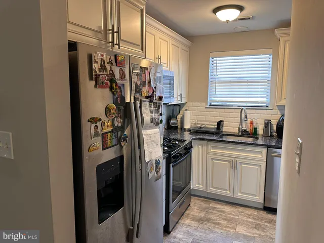 a bedroom with a bed and a flat screen television